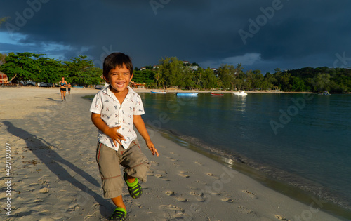 child playing on the beach
