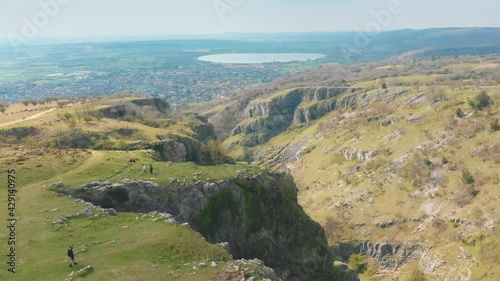 Scenic aerial drone shot of Cheddar Gorge, reservoir and town in Mendip Hills, UK photo