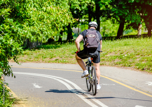 Cyclist ride on the bike path in the city Park  © licvin