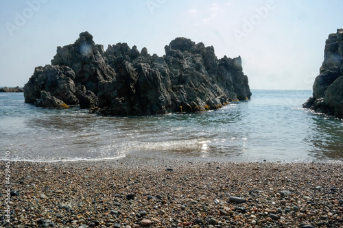 Tough rocks island on the sea