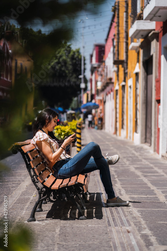 young female tourist sitting outdoors