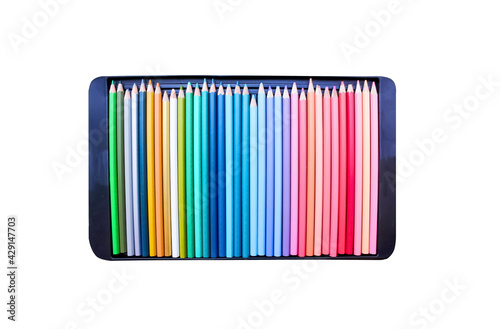 Set of wood colored pencils top view in black plastic tray isolated on white background , clipping path photo