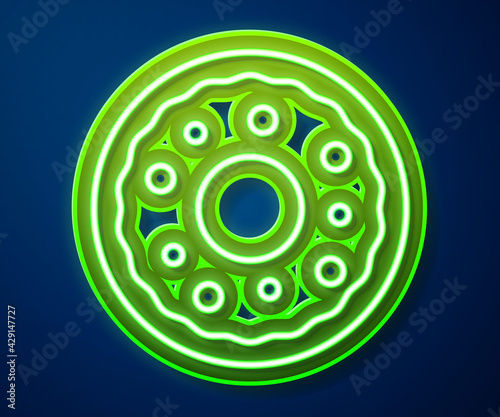 Glowing neon line Donut with sweet glaze icon isolated on blue background. Vector