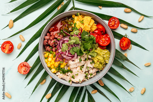 Organic hawaiian chicken poke bowl with rice and vegetables