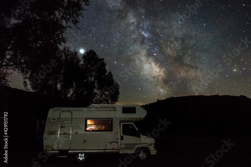 Night Scene with Milky Way above Camper Van