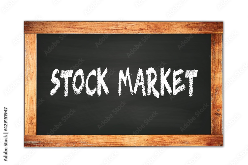 STOCK MARKET text written on wooden frame school blackboard. STOCK MARKET text written on wooden frame school blackboard.