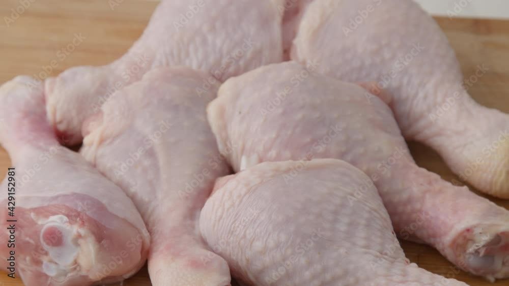 Fresh raw chicken drumsticks on a plate rotating. raw chicken legs on a dish. Cooking food concept. Chicken parts close up footage. Fresh meat. Raw chicken legs for cooking. Raw chicken legs rotate c Fresh raw chicken drumsticks on a plate rotating. raw chicken legs on a dish. Cooking food concept. Chicken parts close up footage. Fresh meat. Raw chicken legs for cooking. Raw chicken legs rotate c