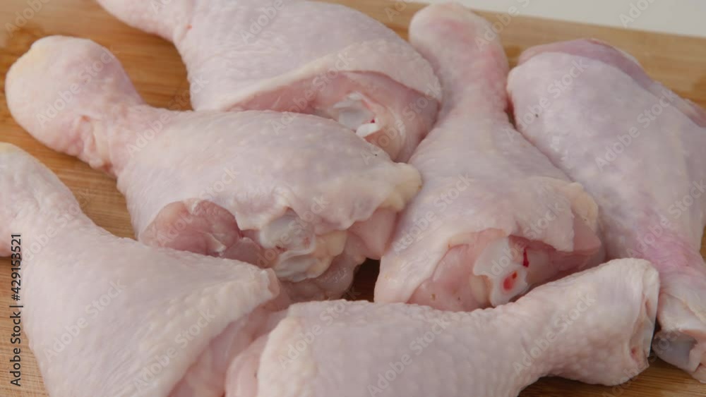 Fresh raw chicken drumsticks on a plate rotating. raw chicken legs on a dish. Cooking food concept. Chicken parts close up footage. Fresh meat. Raw chicken legs for cooking. Raw chicken legs rotate c Fresh raw chicken drumsticks on a plate rotating. raw chicken legs on a dish. Cooking food concept. Chicken parts close up footage. Fresh meat. Raw chicken legs for cooking. Raw chicken legs rotate c