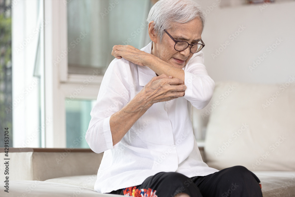Itchy senior woman is scratching her arm causes of itching from