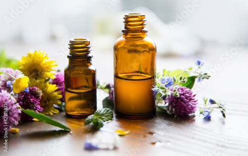 Fototapeta Naklejka Na Ścianę i Meble -  Aromatherapy essential oil bottles, herbal plants and oil