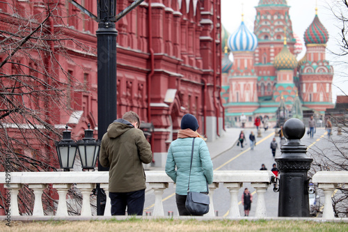 View to the Red square, State historical museum and St. Basil's Cathedral in Moscow. Tourists admire the sights of Russia in the spring