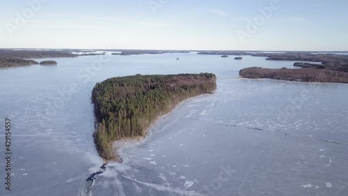 Aerial shot of Island at frozen lake Puruvesi. photo