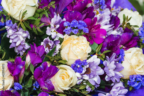 Beautiful flowers in a bouquet. Blue, white, and purple flowers. Background flower image with blue shades.