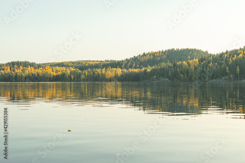 Lake with reflection in sunset light in Isoj  rvi national park  Finlad