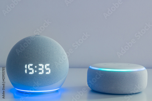 Voice controlled speaker with activated voice recognition, on light background. photo