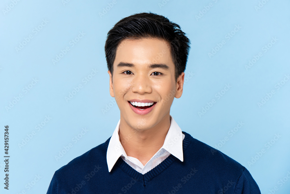 Portrait Of A Young Handsome Asian Man With Blue Eyes And Dark