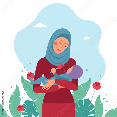Photography Muslim mom holding a small child in her arms.