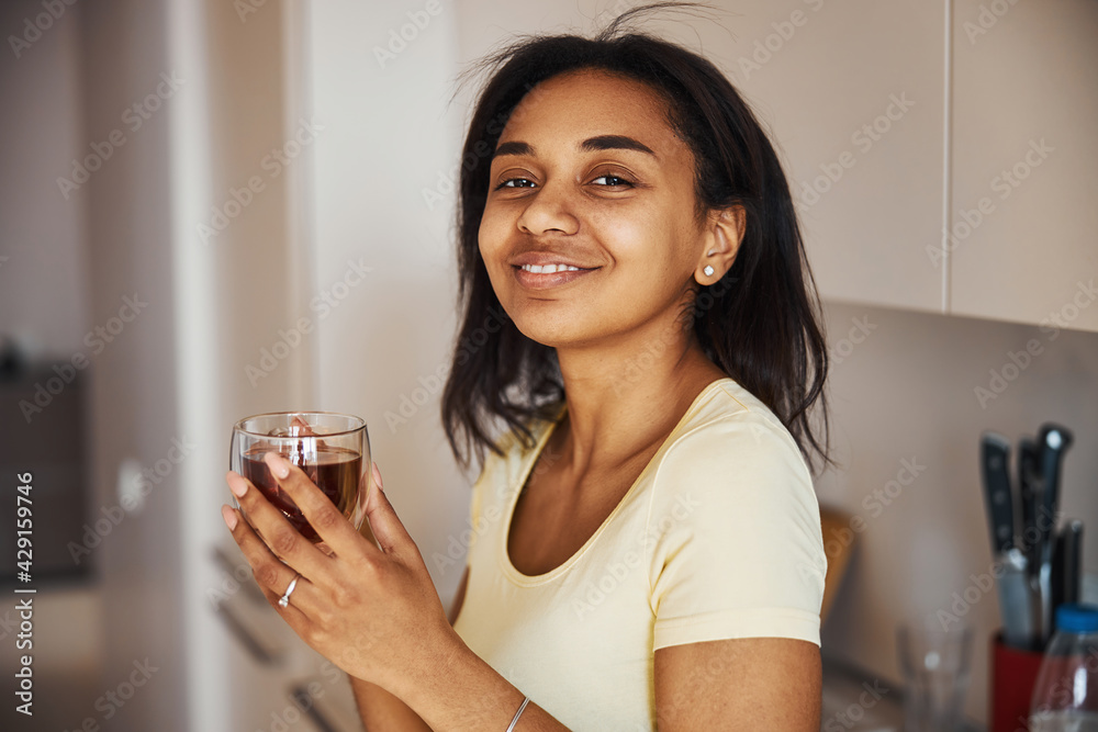 Beautiful Afro American woman drinking tea at home Beautiful Afro American woman drinking tea at home