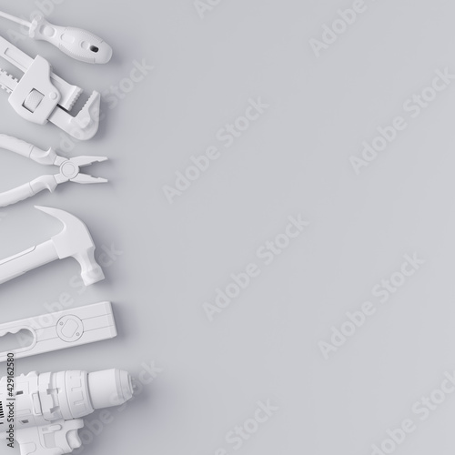 Fototapeta Naklejka Na Ścianę i Meble -  Top view of monochrome construction tools for repair and installation on white