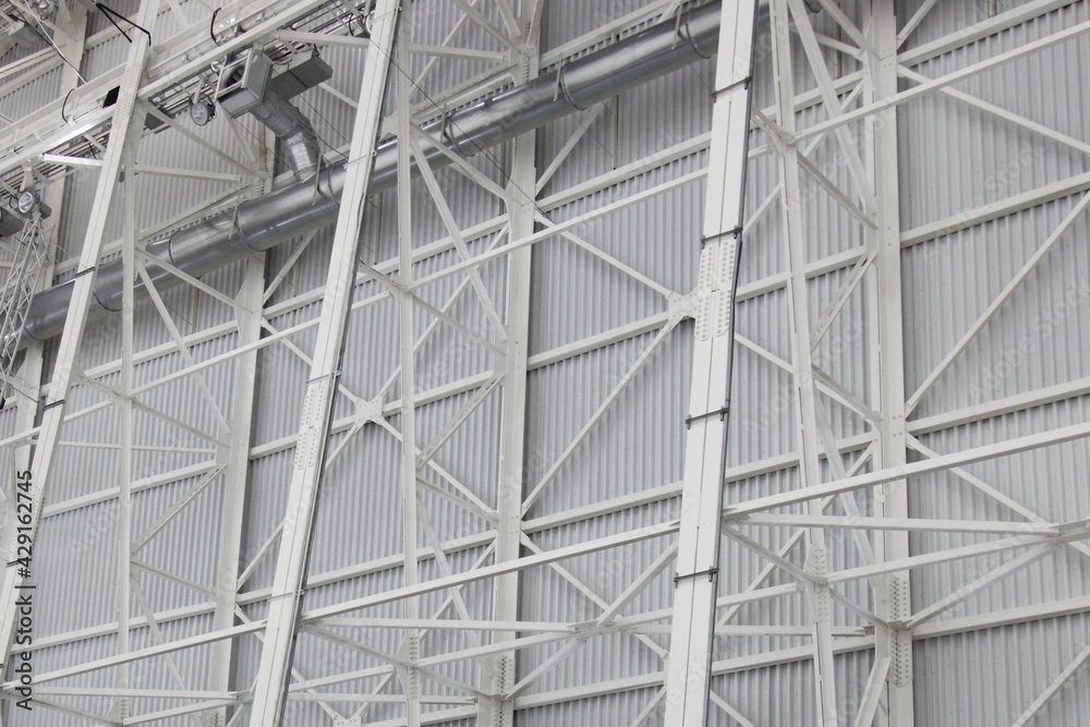 Metal wall frame of a modern industrial building, texture for bachground Metal wall frame of a modern industrial building, texture for bachground