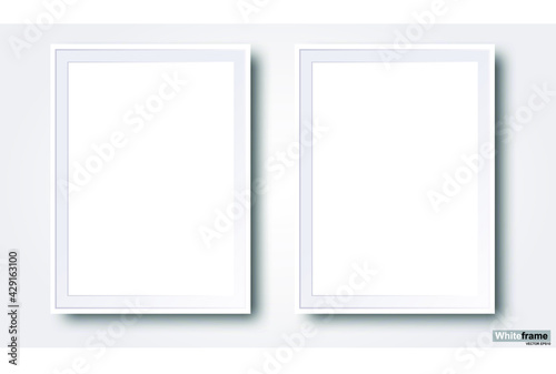 Two realistic blank white photo frames isolated on a central gray background vector EPS10 illustration.