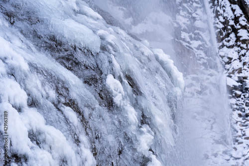 arctic landscape of frozen water from a waterfall in the mountains © Chamois huntress