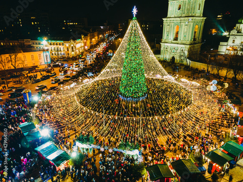 KYIV, UKRAINE - 06 January. 2021. The main New Year tree of the country. People celebrate holidays near the Christmas tree. Sofievskaya Square. photo
