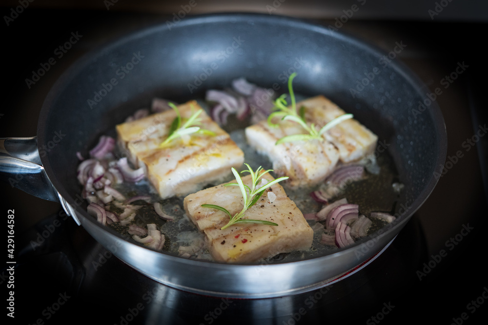 fresh cooking at home - roasted trout fillet in olive oil with red onions and rosemary fresh cooking at home - roasted trout fillet in olive oil with red onions and rosemary
