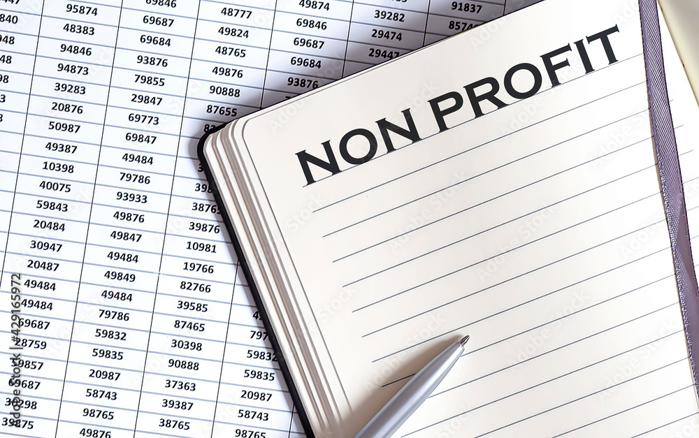Obraz premium Business concept, on the table a notepad with the text of the NON PROFIT