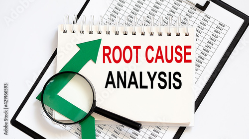 Notebook with Tools and Notes about Root Cause Analysis with chart, business photo