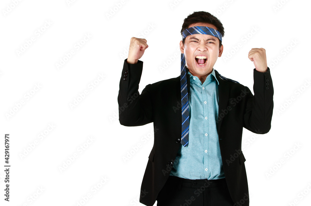 Young Asian man smiling standing wearing black suit tie a necktie on the head and Showing signs of joy in working to be successful on a white background. Concept businessman success cheerful happy. Young Asian man smiling standing wearing black suit tie a necktie on the head and Showing signs of joy in working to be successful on a white background. Concept businessman success cheerful happy.