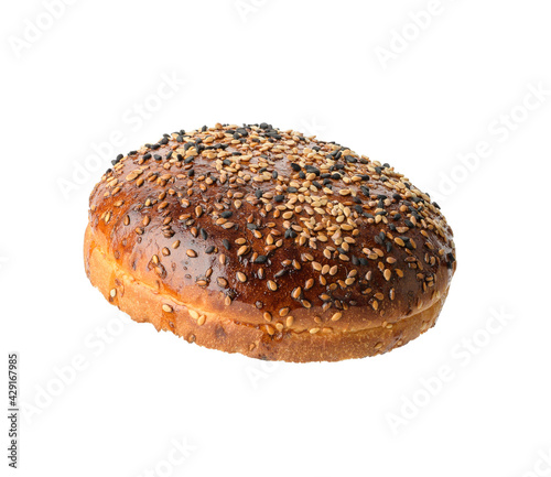 top half of baked brown round sesame bun for hamburger