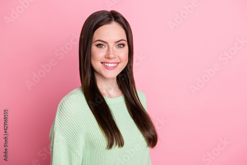 Portrait of gorgeous person half turned beaming smile wear pullover isolated on pink color background