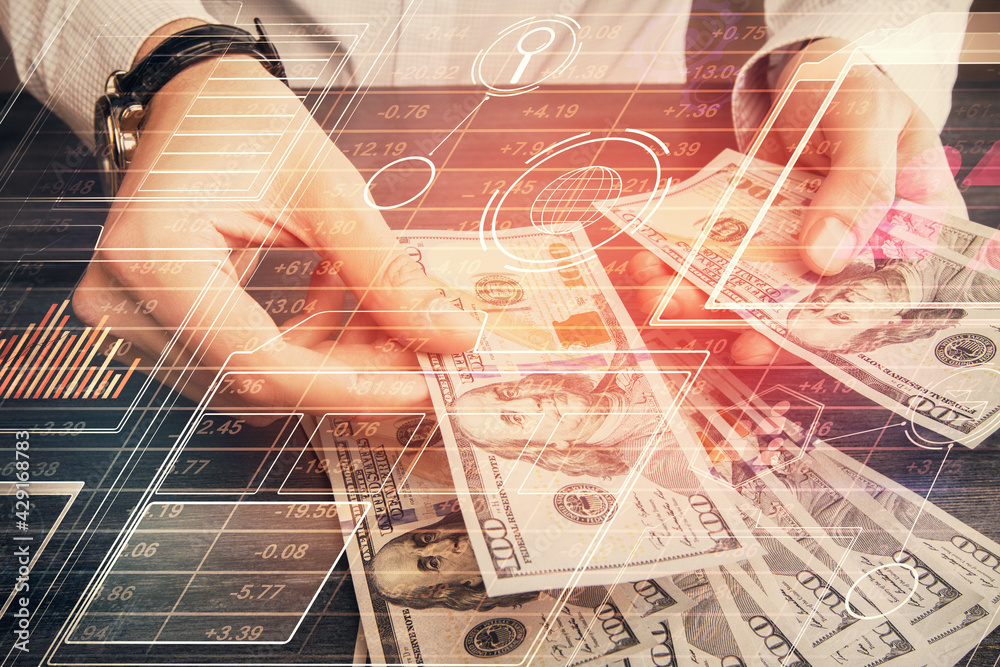 Double exposure of technology drawing hologram and us dollars bills and man hands. Data concept Double exposure of technology drawing hologram and us dollars bills and man hands. Data concept