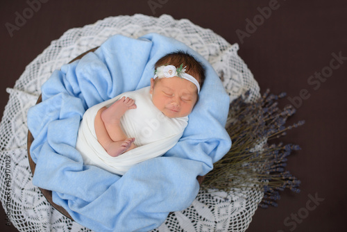 Adorable newborn baby is sleeping. Beginning of life and happy childhood concept
