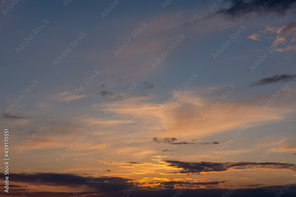 a sunset with orange clouds