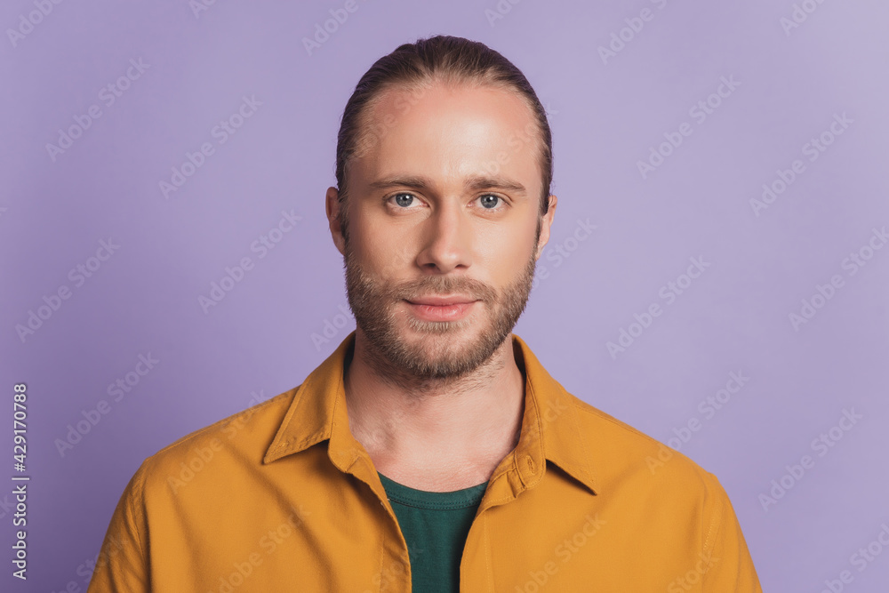 Close up portrait of handsome manly guy with beard posing