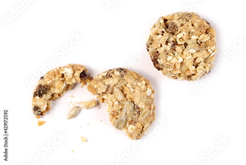 Muesli cookies  granola biscuits with peanuts  raisins and sunflower seeds isolated on white background  top view