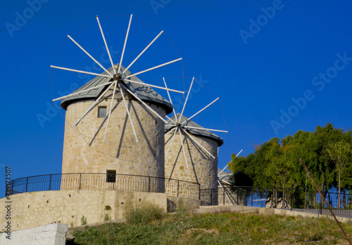 old windmill with blue sky in alacati, cesme Izmir