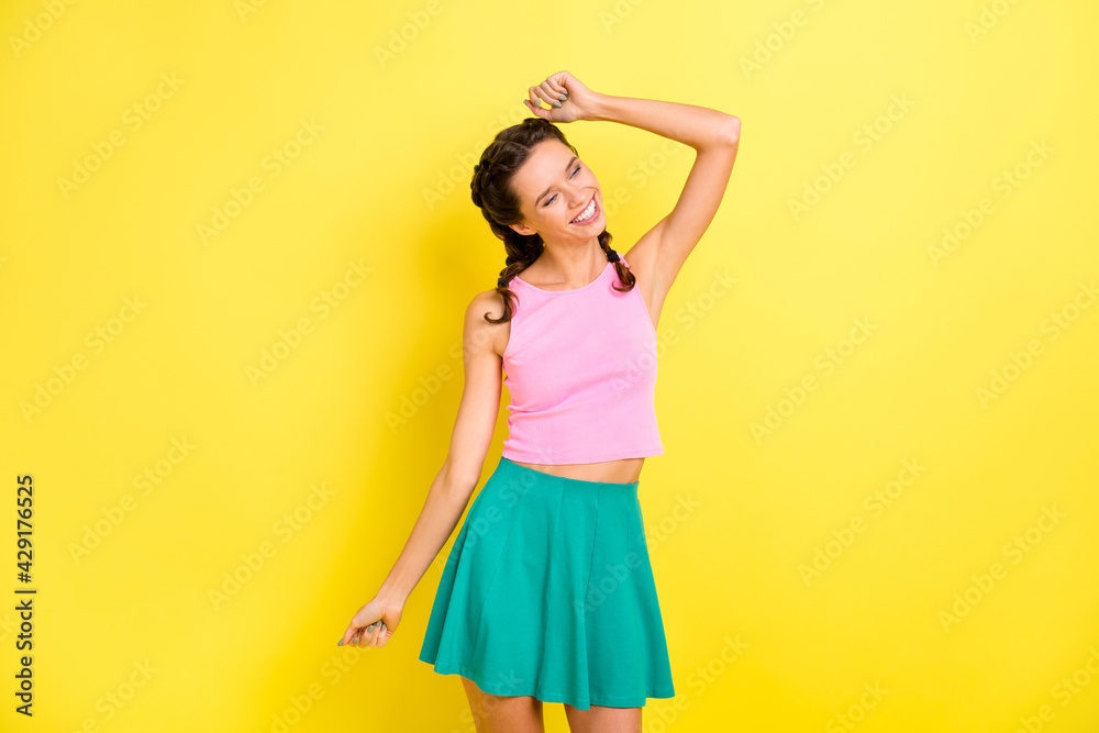Photo of adorable shiny young lady braids dressed singlet closed eyes dancing isolated yellow color background Photo of adorable shiny young lady braids dressed singlet closed eyes dancing isolated yellow color background