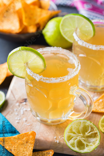 Mexican alcohol cocktail chelada with light beer and lime juice