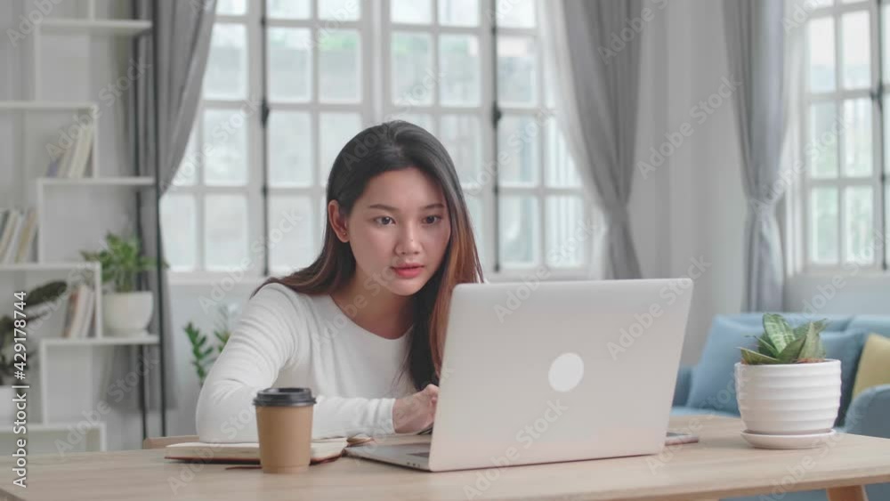 Asian Girl Use Laptop Computer And Celebrating At Home
Asian Girl Use Laptop Computer And Celebrating At Home