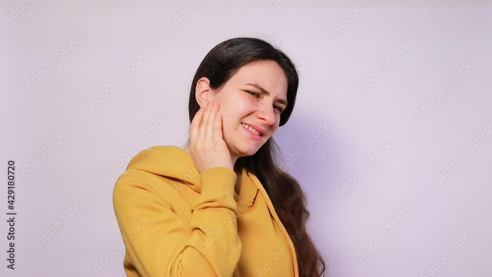 The woman has a sore ear infection, inflammation from infection and otitis. Arthritis temporal