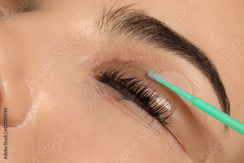Canvas Print Young woman undergoing eyelash lamination, closeup