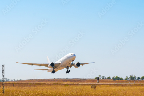 Photos Passenger plane takes off from runway in airport