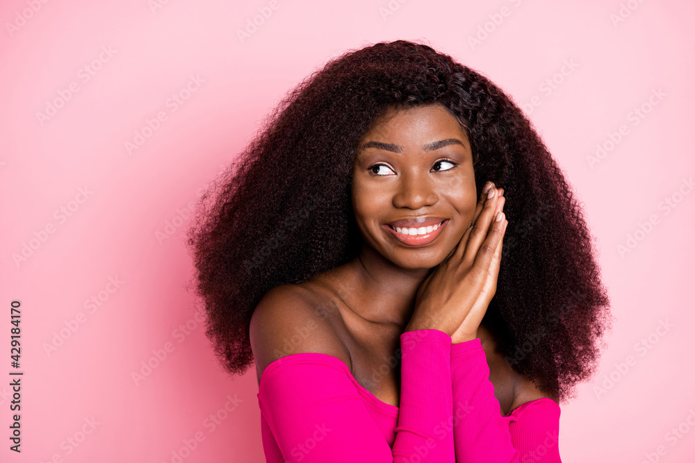 Photo of dreamy adorable lady look empty space palms cheek wear top uncovered shoulders isolated pink color background Photo of dreamy adorable lady look empty space palms cheek wear top uncovered shoulders isolated pink color background