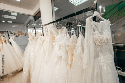 Wedding dresses in bridal salon in mall