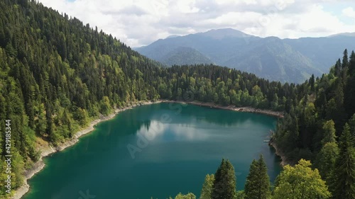 Beautiful lake and forest in the mountains from above photo