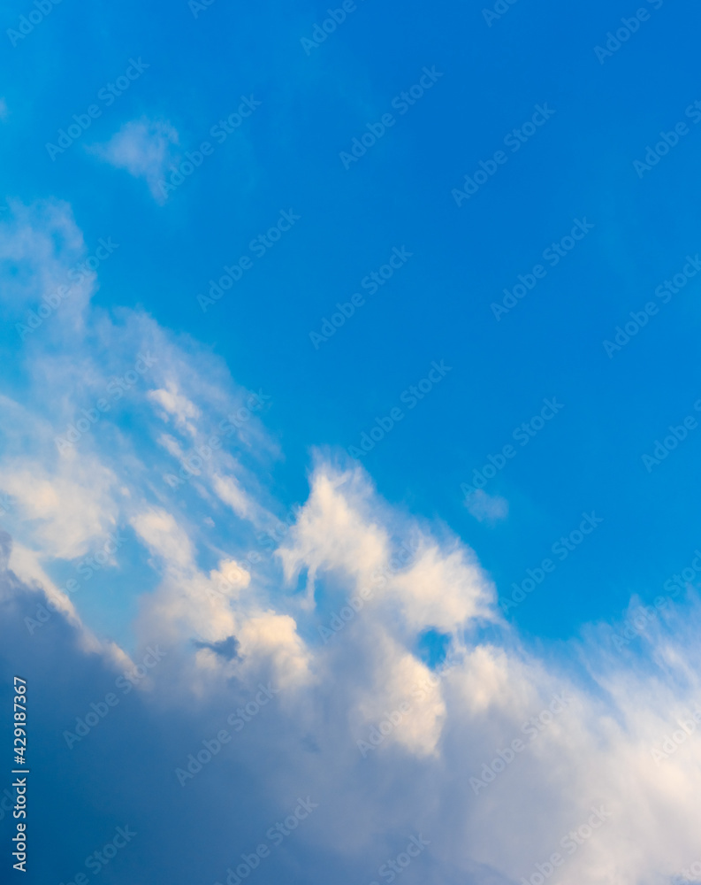 White clouds in the blue sky are located diagonally White clouds in the blue sky are located diagonally