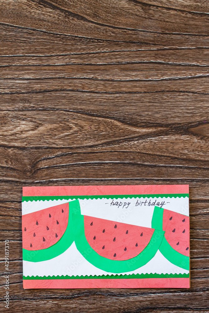 Summer birthday card with watermelons with birthday greetings. Handmade. Childrens creativity project, crafts for kids. Copy space. Summer birthday card with watermelons with birthday greetings. Handmade. Childrens creativity project, crafts for kids. Copy space.